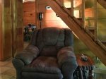 Recliner in living room, with full bath and dining behind